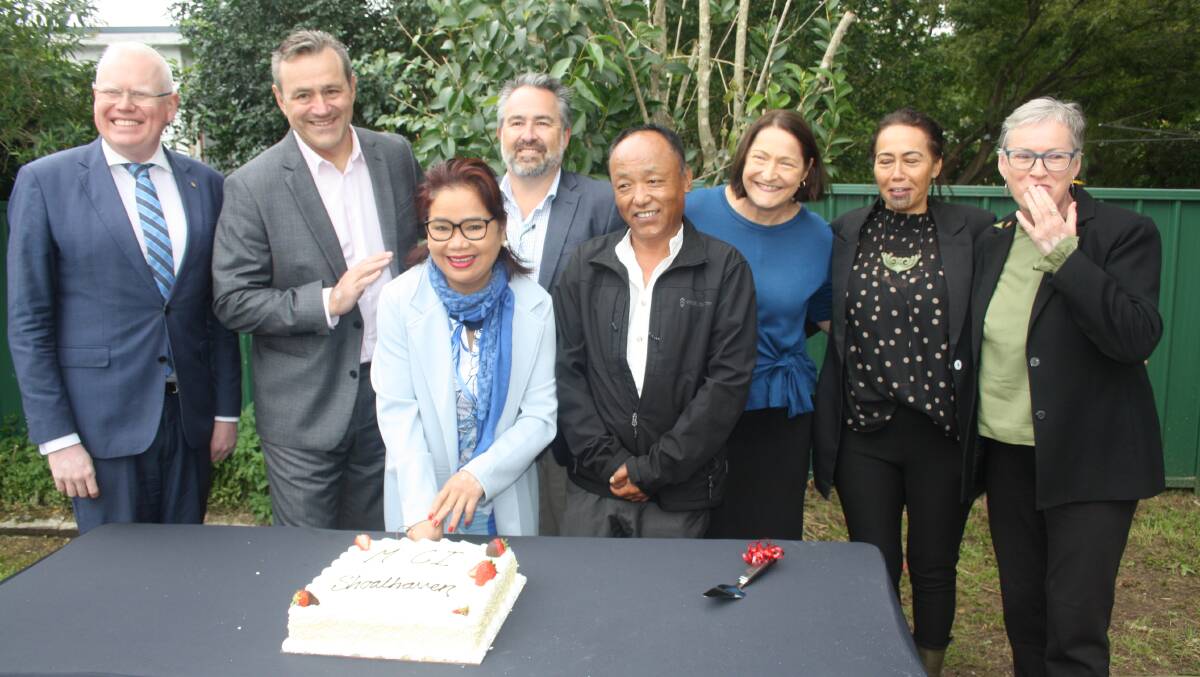 Long-time advocate for the local multicultural community, Jan Frikken, cuts a cake to celebrate the opening on the Multicultural Communities Council of Illawarra's new multicultural hub in Nowra. Picture by Glenn Ellard.