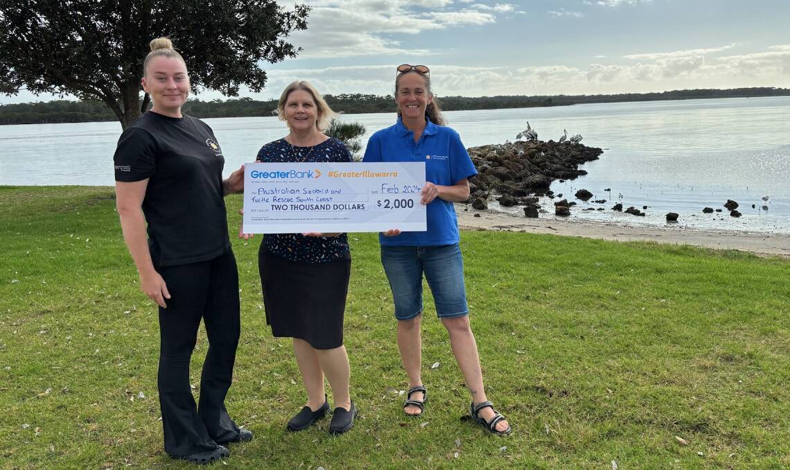 Julie Brammer from the Greater Bank (centre) presents the donation to Lauren Manning-Darby and Belinda Donovan from Australian Seabird and Turtle Rescue. Picture supplied.