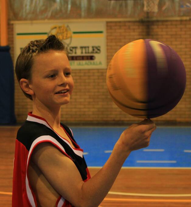 TRICKS OF THE TRADE: Young basketball player Josh Dorrell shows of his skills with the ball, by spinning it on his finger.
