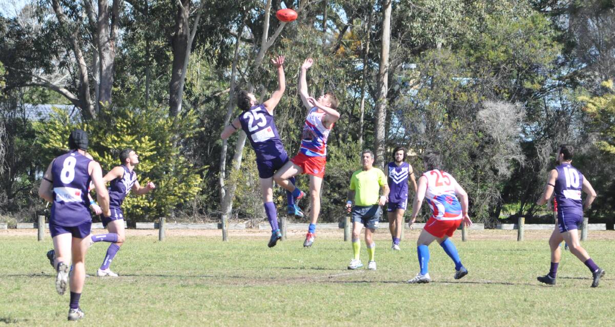 GLORY HUNTERS: Ruckman Mitch Hancock contests the ball on Saturday, as Marcus Ledger, Cody Haub, Matt Thompson and Cruise Turay are in support. Photo: COURTNEY WARD