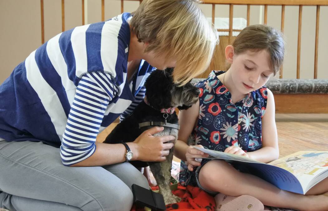 PUPPY LOVE: Sharon Stewart is looking for people to help improve the literacy of children by encouraging them to read aloud to a dog.