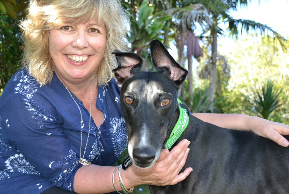 PUPPY LOVE: Deborah Garland with Zac the retired racing greyhound that has become part of the family.