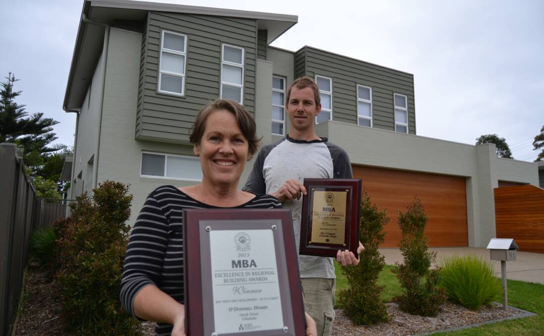FIRST SUCCESS: Debut property developer Liz Provost and builder Pat O'Donnell with the two MBA awards for the new unit complex built in Kalang Street Ulladulla after the original home on the property was destroyed by a storm.