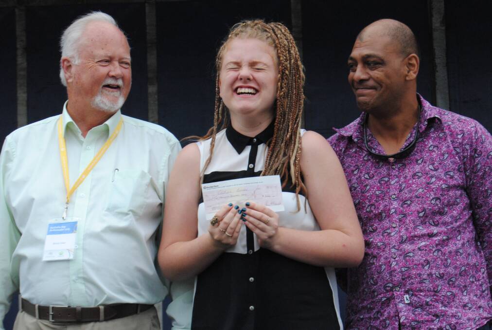IT'S ON AGAIN: Milton Ulladulla’s 2015 Australia Day ambassador Bruce Elder and Freddie Simon from the Times congratulate an ecstatic Caitlin Bonser on her win.