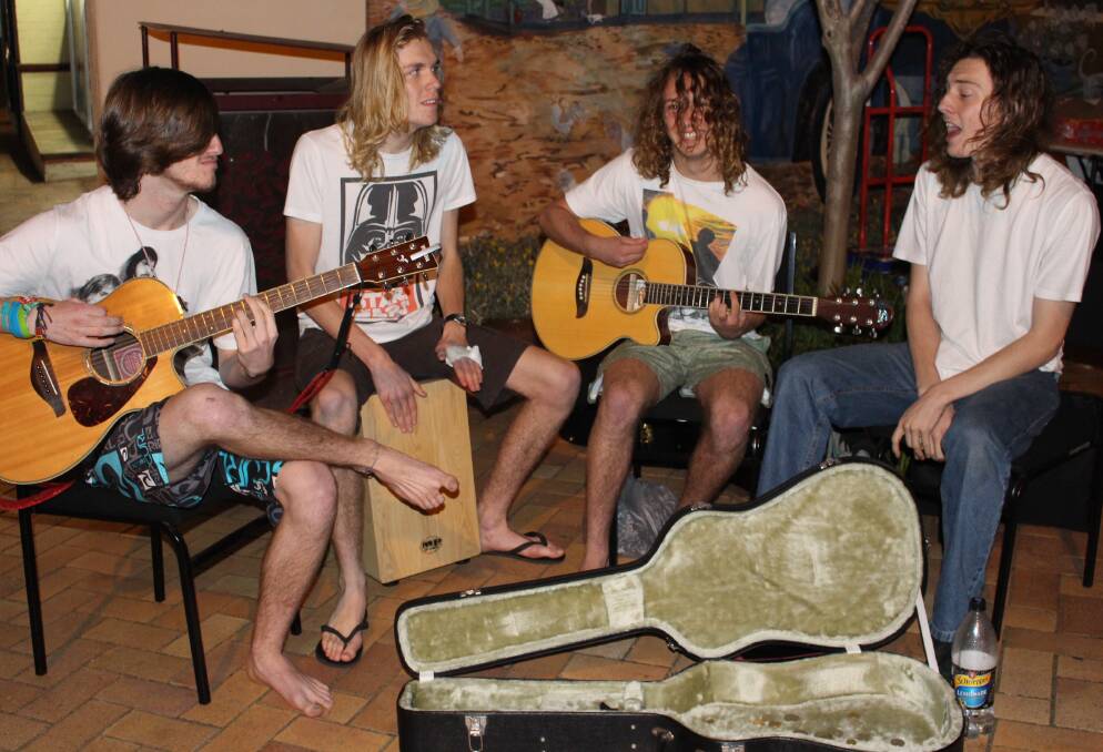 QUITE LIKE PETE: Young musicians Ian Tennant, Sam Boland, Shaun Riley and Mitchell ‘Turtle’ Berwick playing at the Milton Gallery Walk. Photo: KATRINA CONDIE