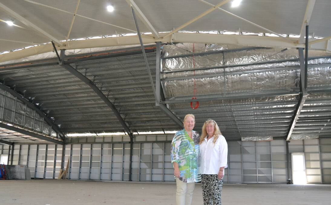 TOUR: Ann Sudmalis MP and Gayle Dunn inspect the partially completed shell of the facility's multi purpose centre after officially opening two new classrooms at the Dunn Lewis Centre on Friday. Photo: Jessica Clifford.