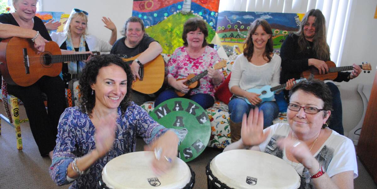 UP BEAT: Warming up for Make a Noise are Sunflower House clients and support workers Liz Jeffriess, Leone Rogers, Cheryl Hughes, Robyn Evans, Kylie Rawson, Tanya Roberts-Goss, Julie Jefferys and Michelle Shea.