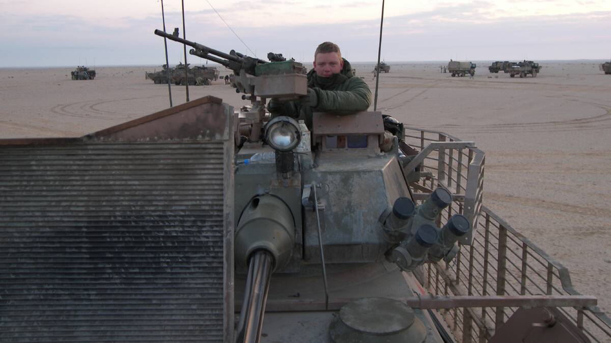 COMBAT EXPERIENCE: Aaron Gray in the turret of an army ASLAV armoured vehicle in Iraq. 