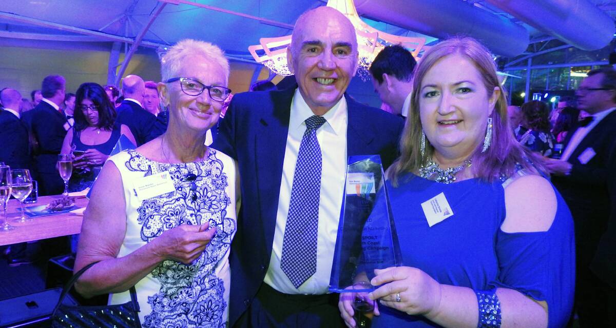 UNSPOILT SPOILERS: South Coast Regional Tourism chair Catherine Shields (right) holds the destination marketing trophy, alongside hosted accommodation runners-up Ken and June Banks from Mollymook Beach Waterfront.