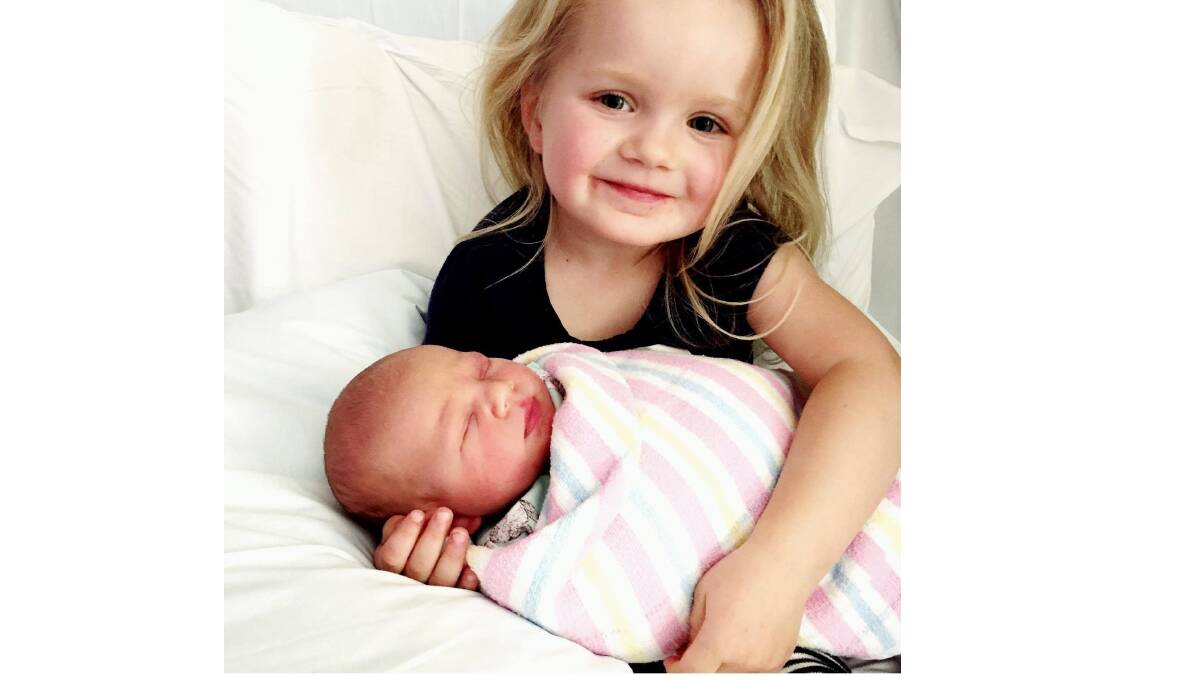 LOVE: Georgia Mees holds her new brother Bobby. Photo: supplied. 