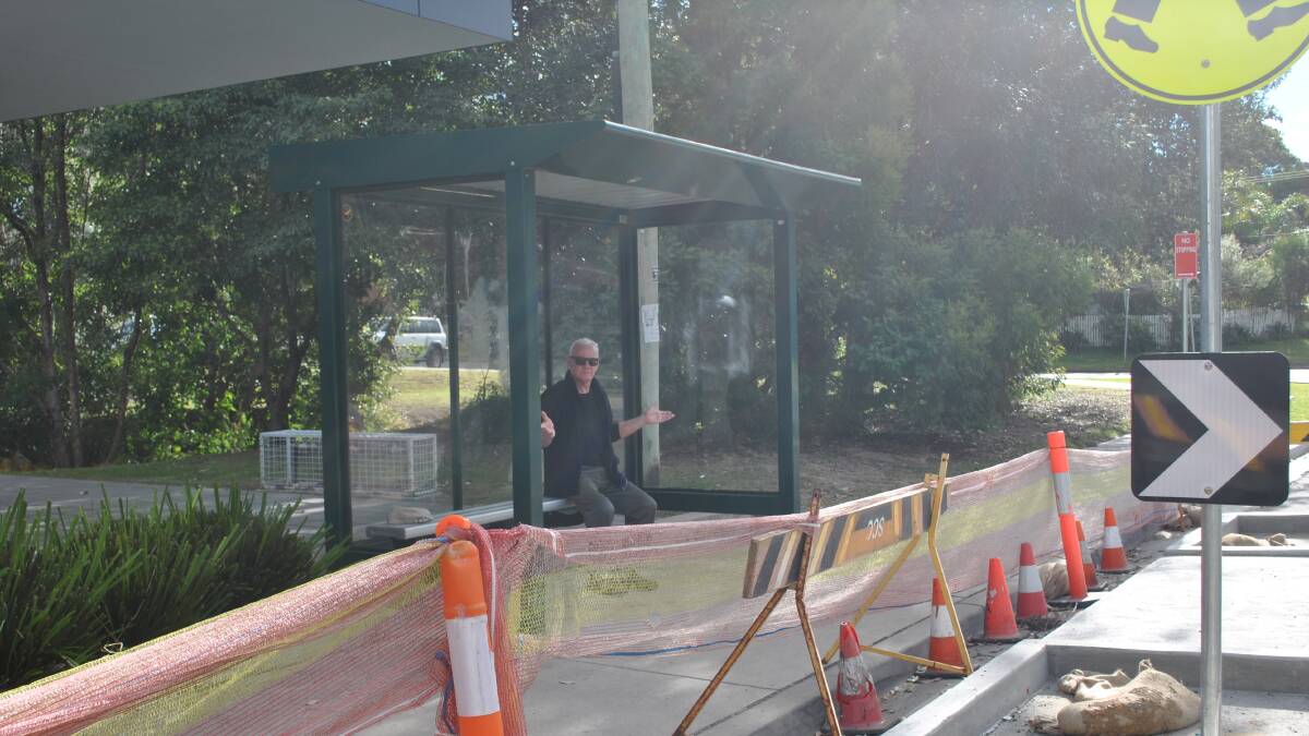 READY AND WAITING: Peter Earley waiting for a bus at the old shelter on the southern side of Tallwood Avenue, Mollymook. Photo: Jessica McInerney. 