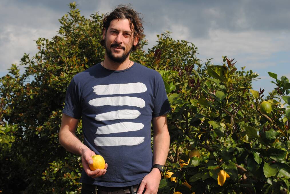 PADDOCK TO PLATE: St. Isidore chef and owner Alex Delly in his restaurant’s orchard. Delly designs the menu to maximise the use of homegrown and local produce. 