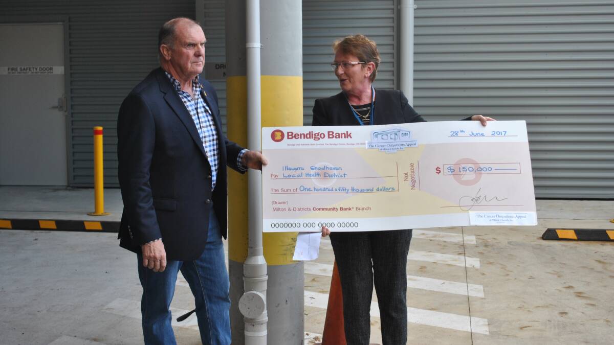  Cancer Outpatients Appeal president Peter Still presents ISLHD chief executive Margot Mains with a cheque for $150,000. 