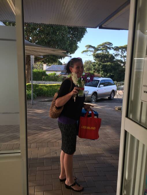 FAREWELL: Katrina Condie leaves the office for the last time after 23 years at the Milton Ulladulla Times.