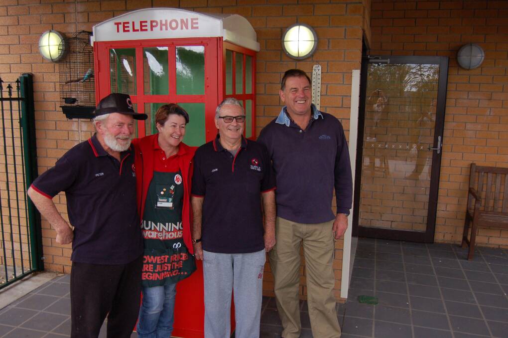 RING RING: Peter Dorrell (Ulladulla Men’s Shed), Vicky Sansom (Bunnings), John Tierney and Roger Halls (Ulladulla Men’s Shed) unveil the new telephone booth at the Sarah Claydon dementia unit.