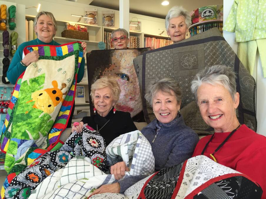 TWITTERERS: Wendy Muir, Avril Hargreaves, and Robyn Coogan (front) and Sydney Rothe, Sammy Gakille and Barb Steller (back) show of their quilts at The Mulberry Tree store to be displayed at the South Coast and Country Quilters Show.