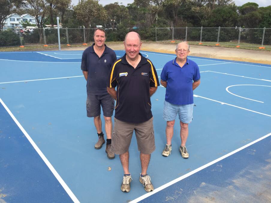 FINALLY: Bruce Hughes, Richard Nesbitt and Clive Cross after a working bee a few weeks ago to get the new court ready to open.