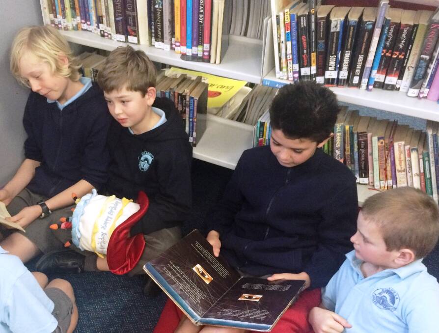Kai Minassian, Cameron Campbell, Tyrone Matthews and Joel Payne from Years 3 and 6 enjoyed buddy reading in the UPS Library.