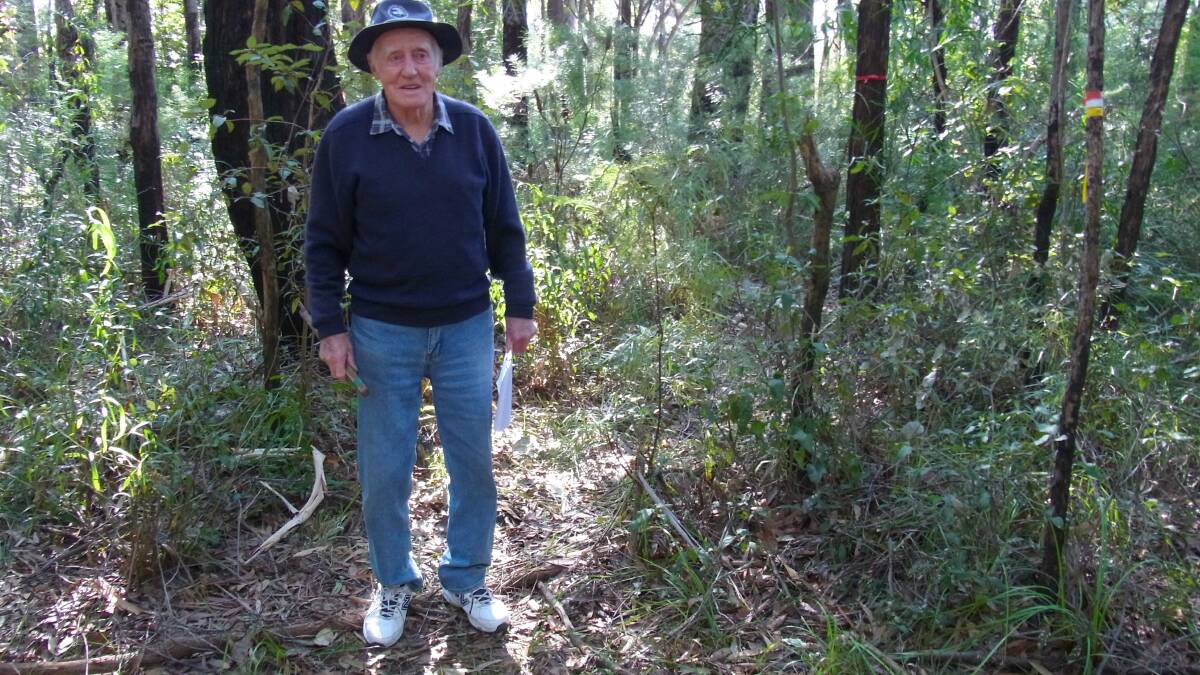 ON TRACK: Bill Giles marks out the new walking track in Ulladulla.