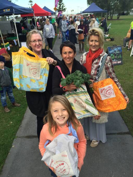 ENVIRONMENTALLY FRIENDLY: Fiona Schreurs, Simi Chee, Valerie Morrow and Evie Snyders show off the market's boomerang bags. 