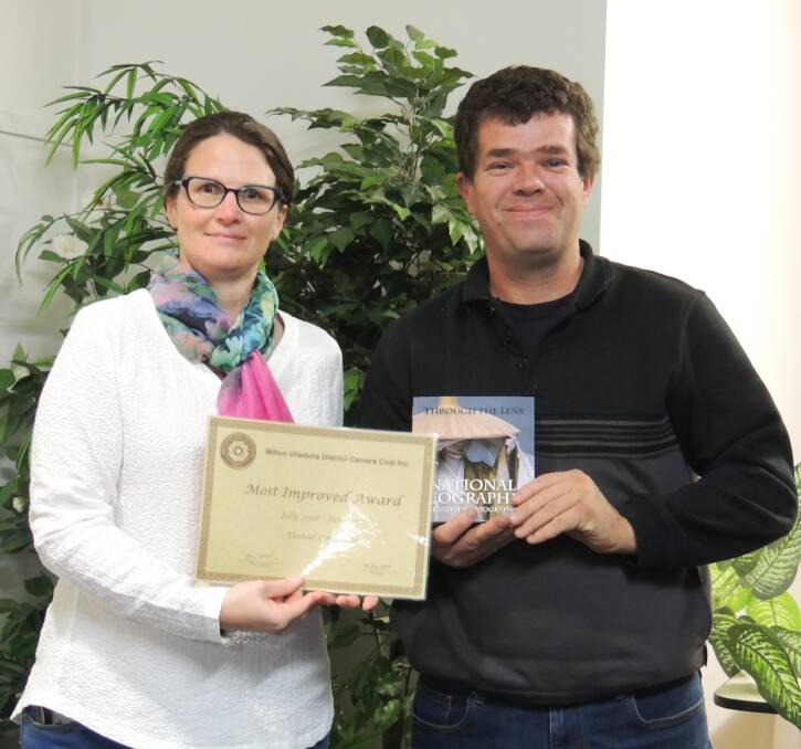 PROUD: Camera Club president Dawn Woods congratulates Daniel Colebrook on his Most Improved Award.