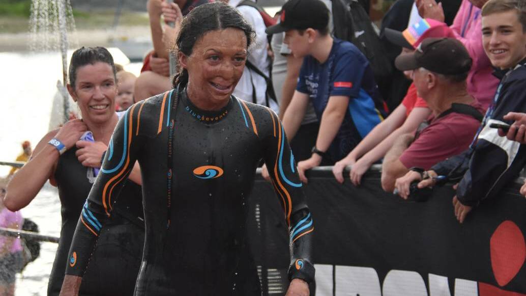 TESTING HER METTLE: Turia Pitt finishes the swim leg of the Port Macquarie Ironman competition on Sunday. Photo: Peter Gleeson Port Macquarie News.
