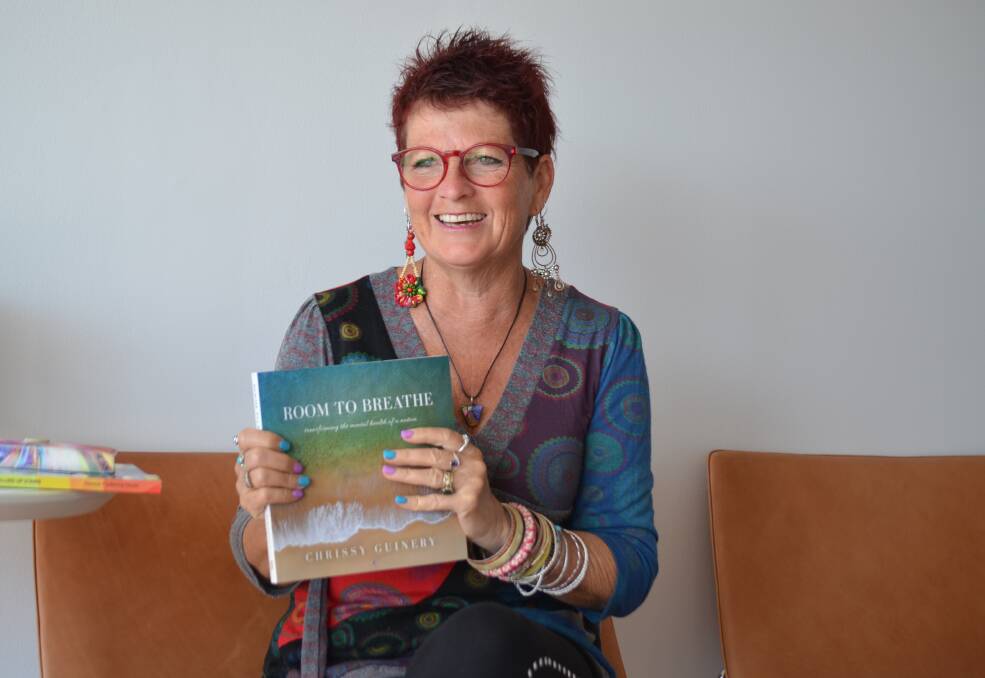 ROOM TO BREATHE: Chrissy Guinery, with her book showcasing the mental health challenges and support strategies of 90 Australians.