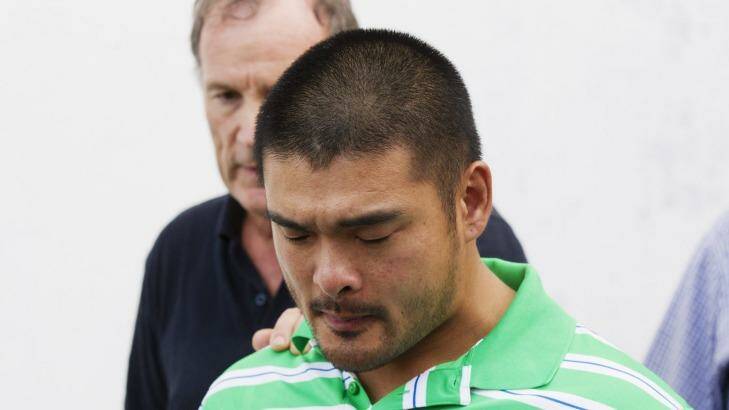 Andrew Chan's brother, Michael, holds back tears. Photo: James Brickwood