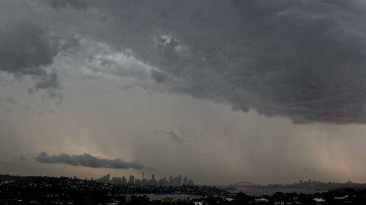 The storm clouds and rain hitting the city on Monday afternoon. Photo: Ben Rushton