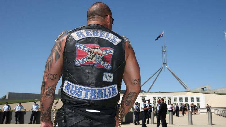 A patched Rebels member who was among riders protesting bikie laws at Parliament House in Canberra in December 2014. Photo: Alex Ellinghausen 