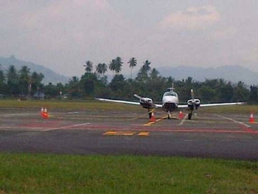 The Australian plane involved in an airspace dispute sits on the tarmac at Sam Ratulangi International Airport in Manado.