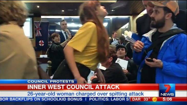 Cartoonist Nicola Minus has been charged with spitting on Richard Pearson, the newly appointed head of the Inner West Council during a protest against council amalgamations. Photo: Channel Seven