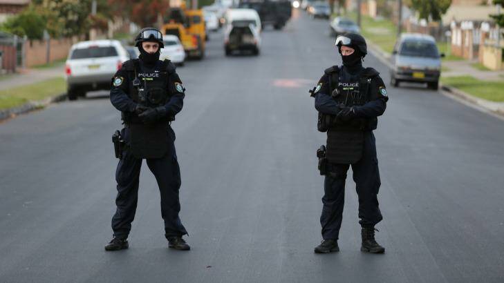 Police conduct a raid in Lockwood Street, Merrylands. Photo: NSW Police Media