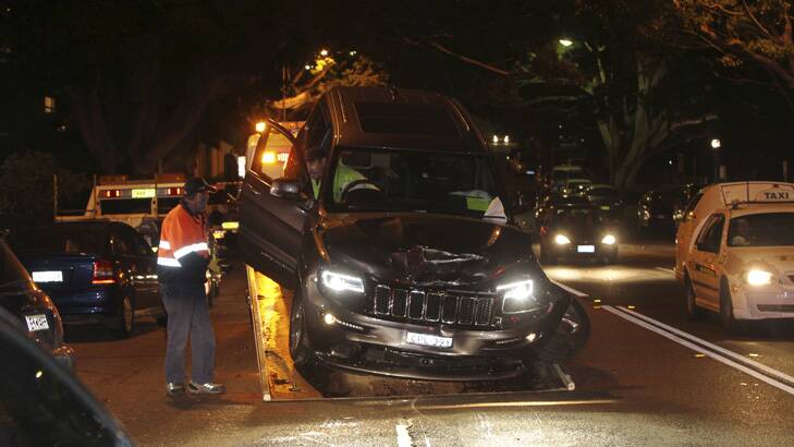 The Jeep driven by Buddy Franklin is removed from the scene after the crash. Photo: Britta Campion
