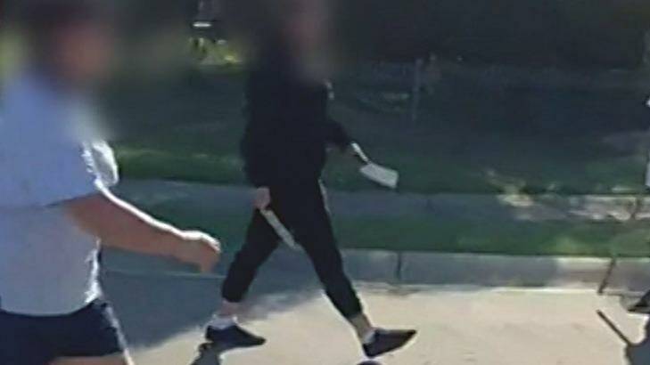 A teen is seen with a kitchen knife and a cleaver. Photo: Channel Nine