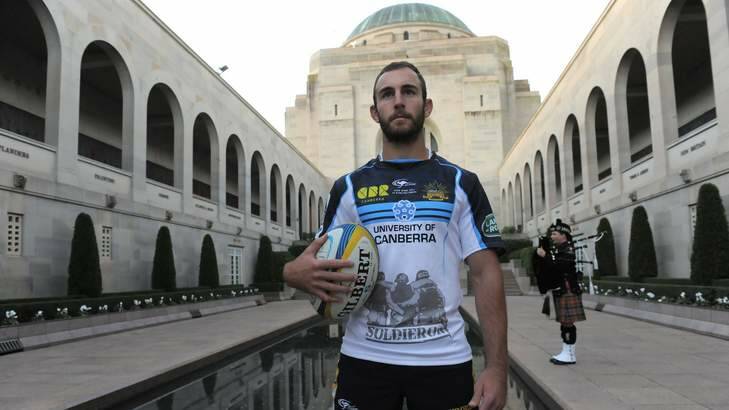Brumbies player Nic White was one of four players involved in a wreath laying ceremony ahead of their Anzac Day match. Photo: Graham Tidy
