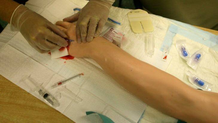 Students practice on a latex dummy at the University of Sydney's medical school. Photo: Michele Mossop 