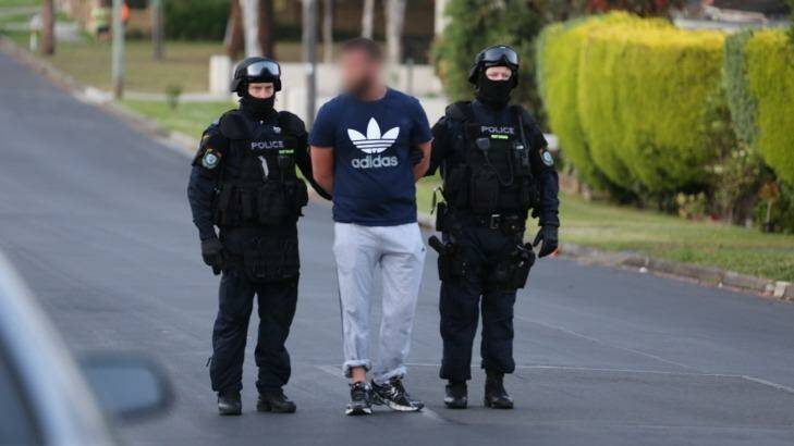 A man is arrested in Lockwood Street, Merrylands. Photo: NSW Police Media