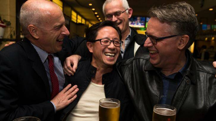 Matthew Ng, centre, celebrates his release from jail with his lawyer, Tom Lennox, left, and friends from his days studying at the Australian Graduate School of Management. Photo: Janie Barrett