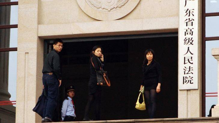 Matthew Ng's wife Niki Chow, his older sister and  younger brother at Guangdong Supreme Court in March 2012. Photo: Sanghee Liu