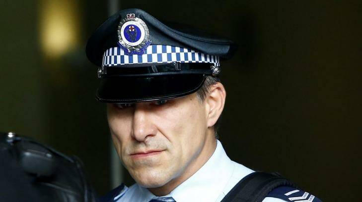 Senior Constable John Wasko leaves the Downing Centre Local Court on Tuesday. Photo: Daniel Munoz