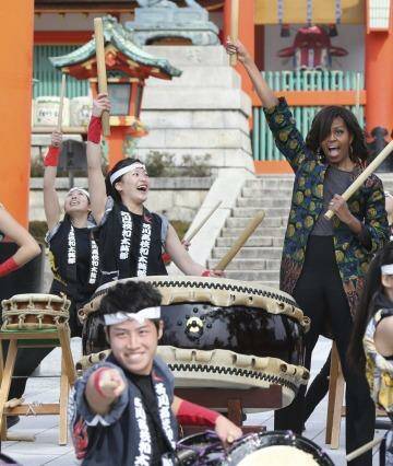 US first lady Michelle Obama performs Taiko with the Akutagawa High School Taiko Club during her visit to Fushimi Inari Shinto Shrine in Kyoto, in western Japan, Friday, March 20, 2015. Taiko are a a broad range of Japanese percussion instruments, and have a mythological origin in Japanese folklore. (AP Photo/Koji Sasahara) Photo: Koji Sasahara