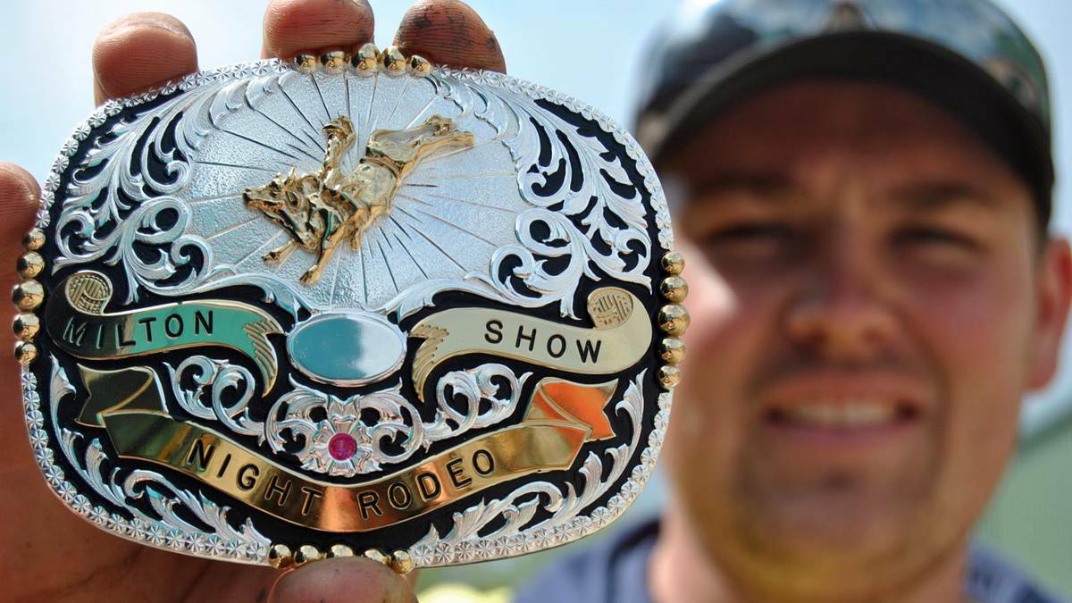 BLING: Jackson Bower shows off the highly sought after Milton Rodeo buckle that will go to the winner of the open bull ride on Friday night.