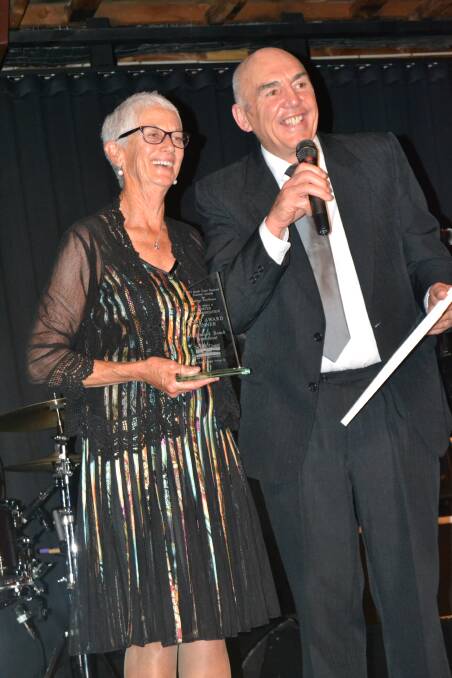 GOLDEN SANDS: June and Ken Banks accepting their gold award in the Hosted Accommodation category at Wednesday night’s South Coast Tourism Awards held at the Ulladulla Civic Centre.