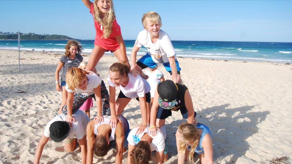 MENTORS: Mollymook Surf Club’s teenage members are building bonds with younger members as part of the Big Fish Little Fish initiative. Photos: KATE BRENNAN