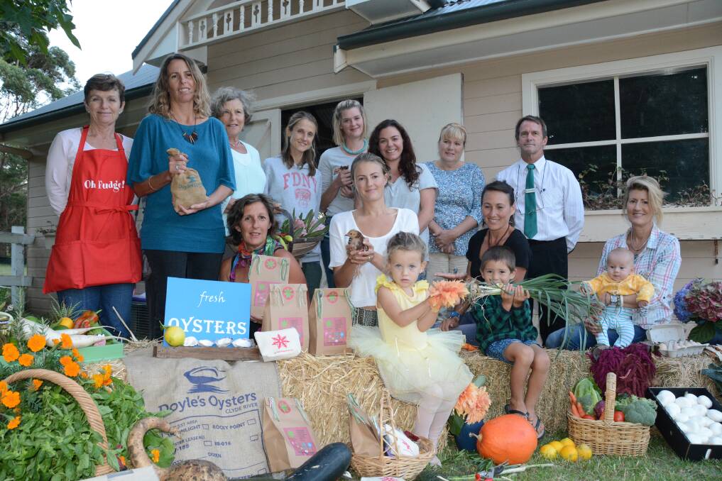 FARM FRESH: Mandy Rowley (BACK LEFT), Suzy Doyle, Helen Moody, Belinda Harding, Skye Longley, Erin Clarke, Michelle Akers, Shoalhaven City Councillor Mark Kitchener, Gail Wild (FRONT LEFT), Dezarae and Elouera Naylor, Simi Chee, Kodi Upton and Valerie Morrow keen to see a farmers’ market up and running in Ulladulla. Photo: RON AGGS