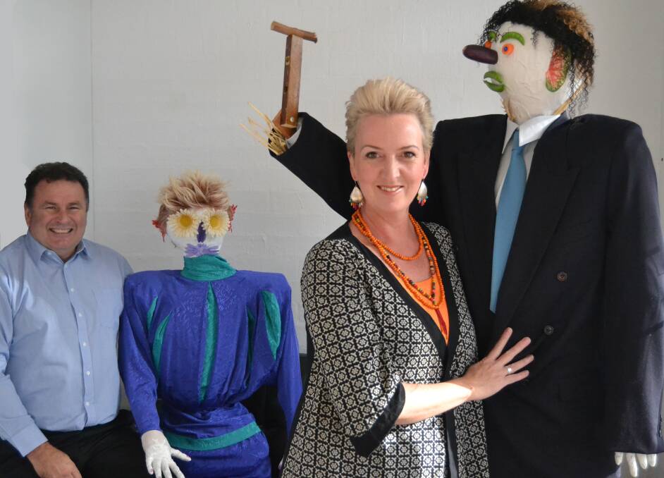 SEEING DOUBLE: Grant Schultz and Rebecca Cameron with their scarecrow doppelgangers on display at Coast Real Estate in Milton.