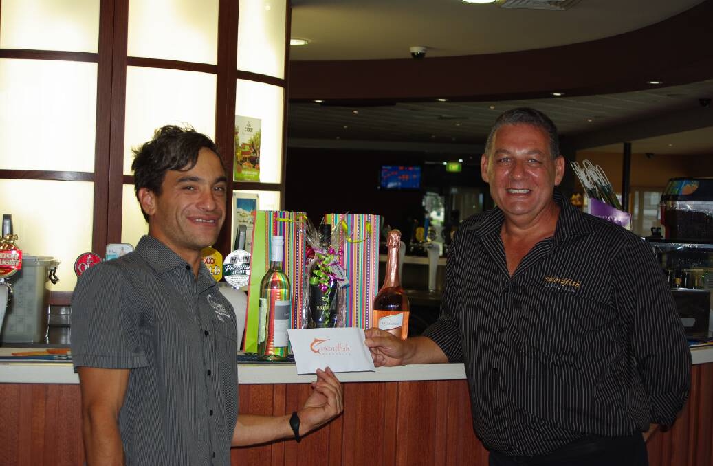 Duty Manager of Ulladulla Bowling Club, and Francis Borg from the Swordfish restaurant with the prizes they have donated. 