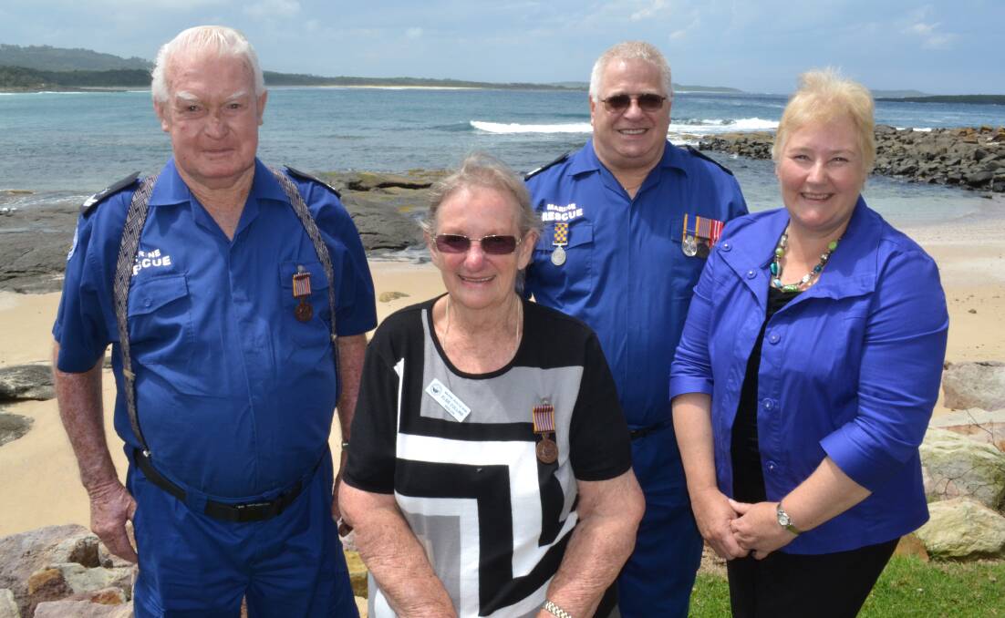 SEASIDE CEREMONY: Member for Gilmore Ann Sudmalis (right) presented Kioloa Marine Rescue members Peter Holmes (left), Elsie Collins and Wido Melis with their long service National Medals and clasps on Monday afternoon.