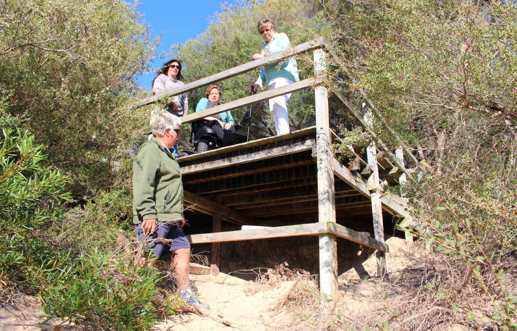 DISREPAIR: Lake Conjola residents Col Ashford (front), Dr Jane Dowling, Nicky Goozee and Robyn Kerves are calling for the aging Conjola boardwalk to be replaced before it is closed to the public.